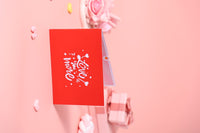 Love You More Heart-Shaped Greeting Card